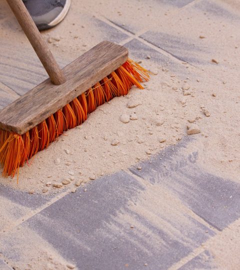 Sand,Spread,Over,The,Surface,Of,Pavers,Or,Tiles,And